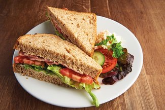 Fresh sandwich with ham and salad